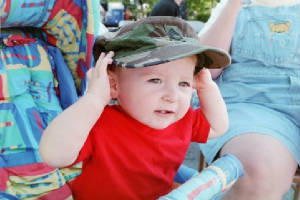 Matt in Daddys hat at the parade
